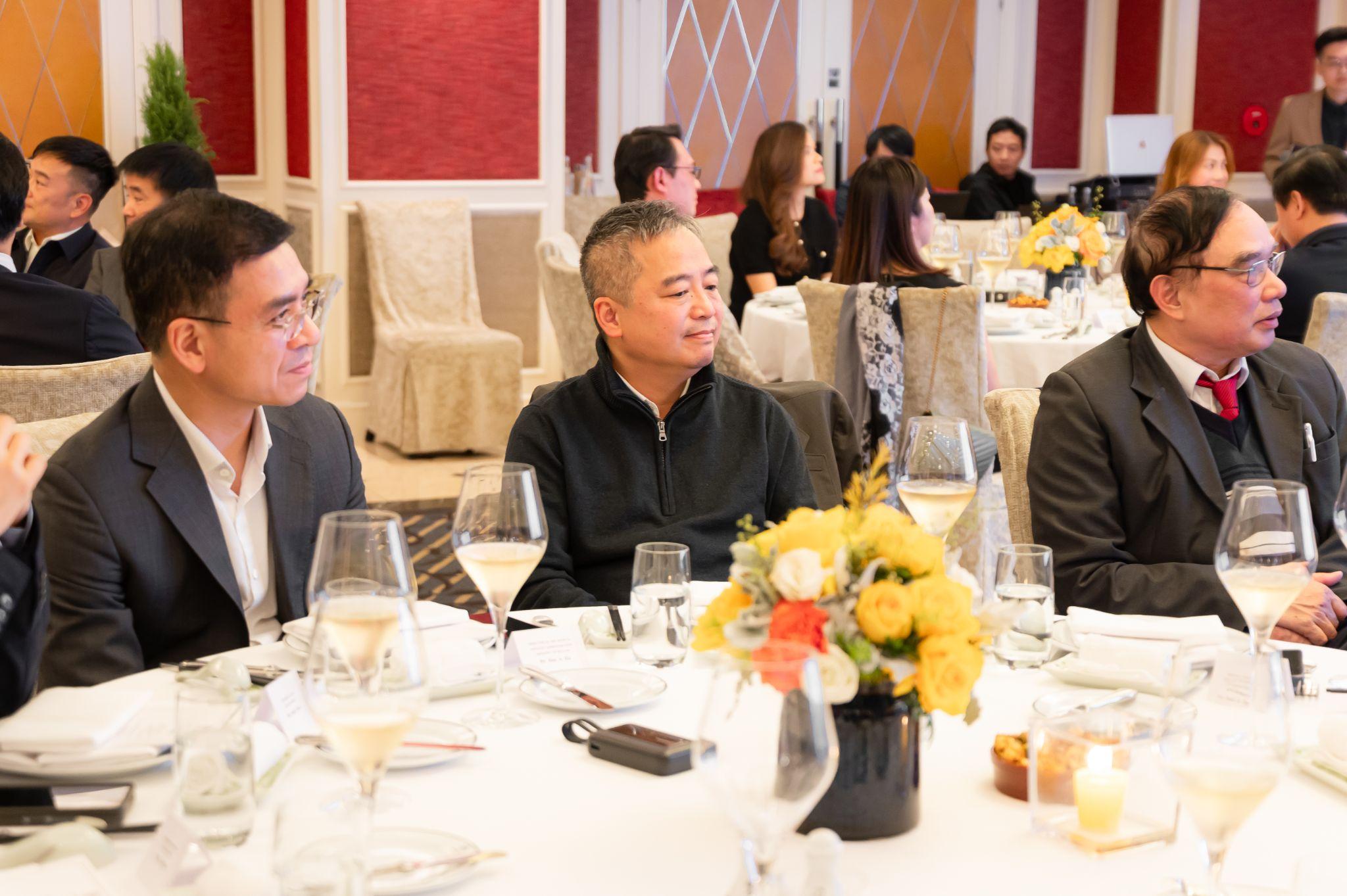 Distinguished medical leaders engaged in dialogue during the symposium.
